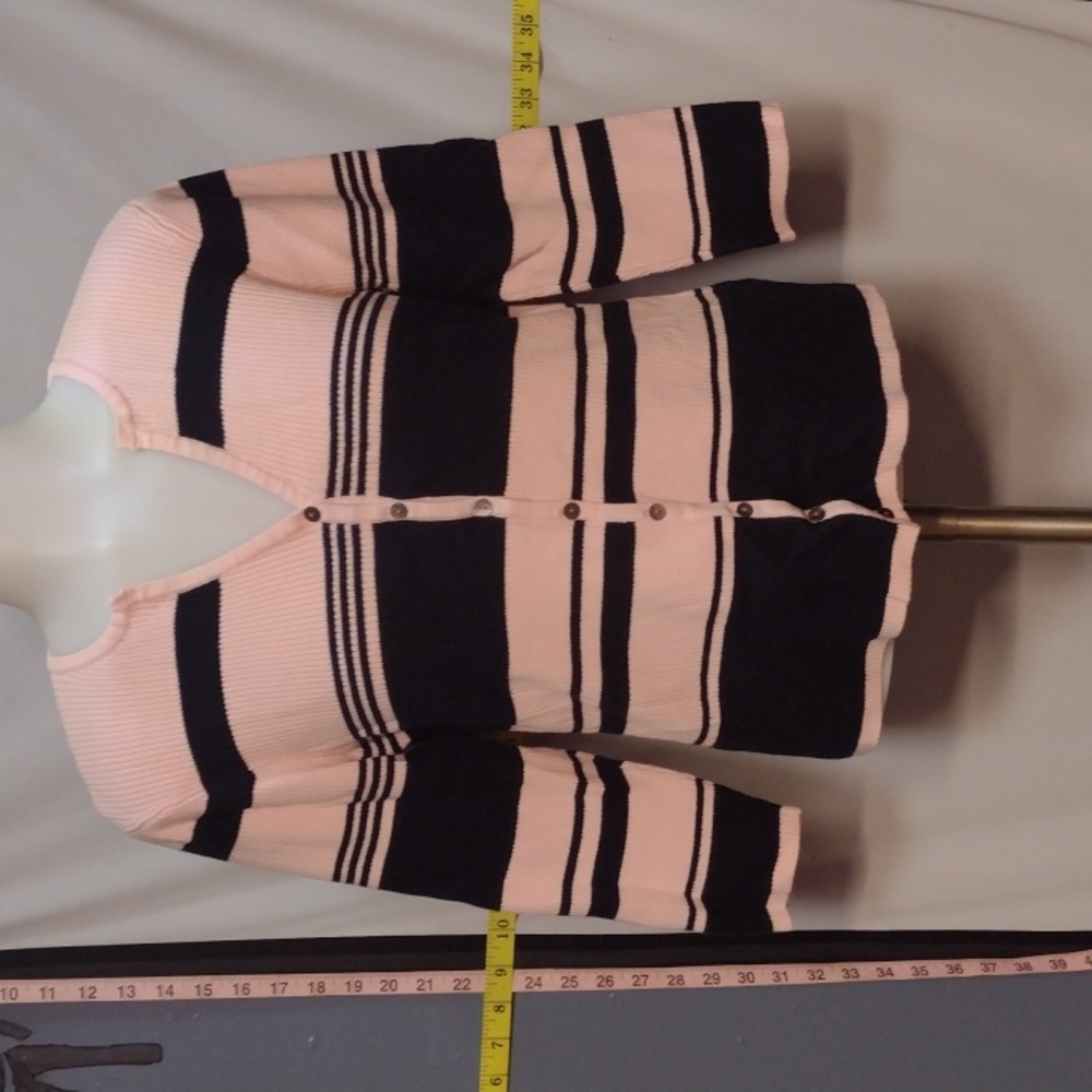 Soft pale pink and black sweater